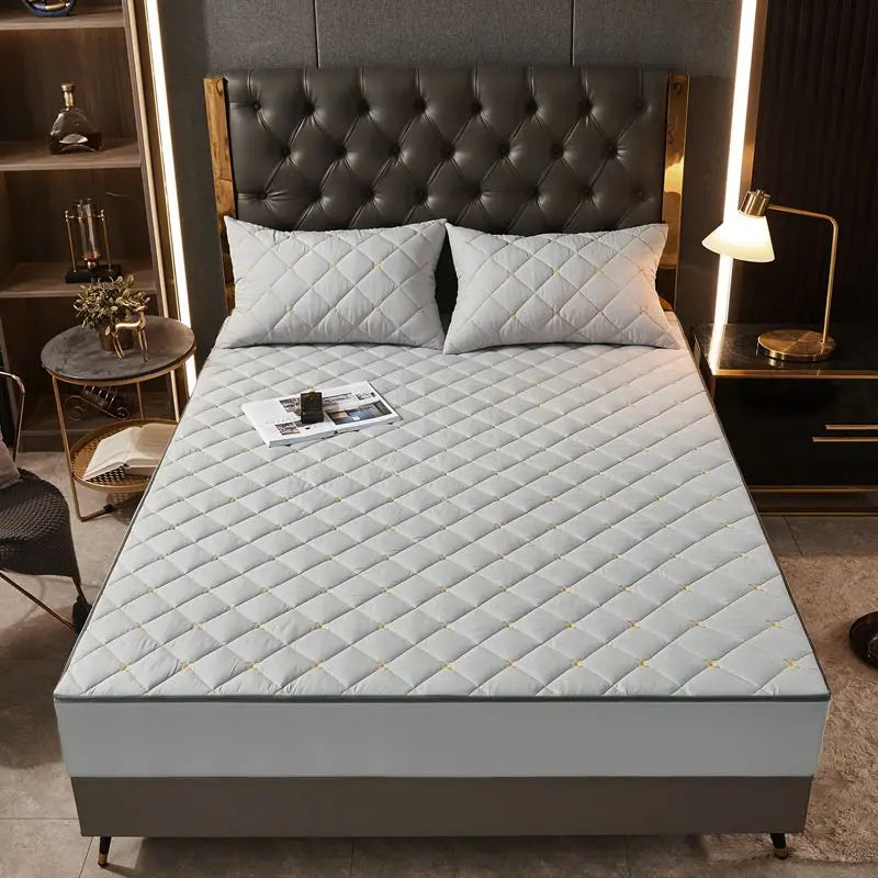 Housse de matelas anti-acarien grise capitonnée